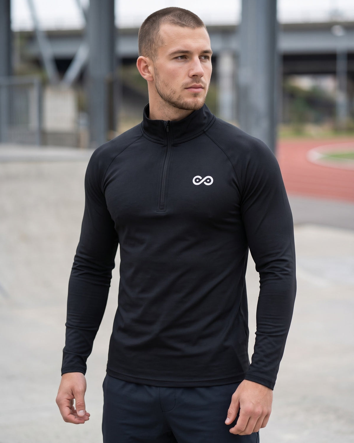 Athlete wearing the black See No Limits Performance Quarter-Zip outdoors